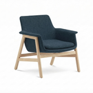 Blue armchair with wooden legs on a white background