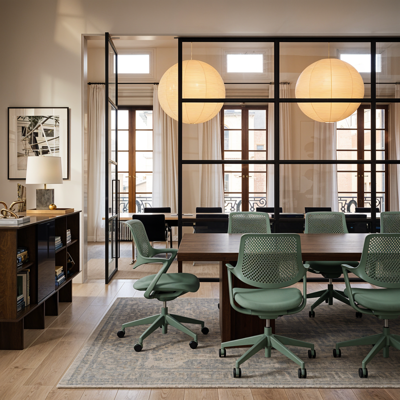 Load image into Gallery viewer, Modern office space with green chairs and a large window.
