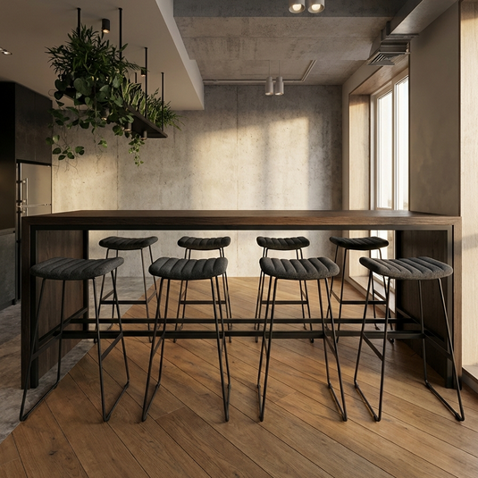 Modern interior with a bar counter and stools in a well-lit room.