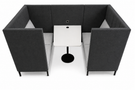 A modern booth-style cafe seating unit with dark gray upholstered sides and back, light gray seat cushions, and a small white table in the center on a black stand, shown on a white background.