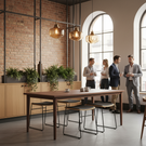 Modern office space with people around a wooden table, brick wall, and large windows.
