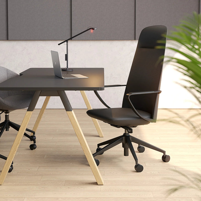 Load image into Gallery viewer, Modern office setup with a black desk, chair, and laptop in a minimalistic room.
