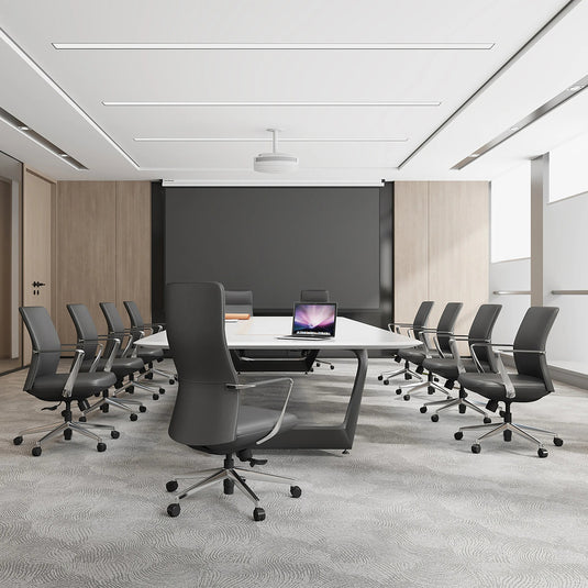 Modern conference room with gray chairs and a large table.