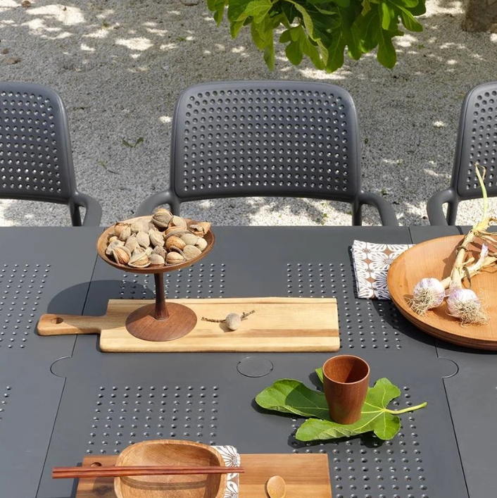 Load image into Gallery viewer, outdoor charcoal chair and table with food and wooden plates
