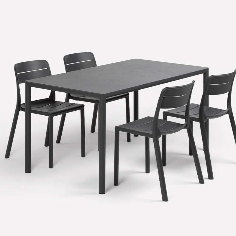Load image into Gallery viewer, Black dining table with four matching chairs on a white background

