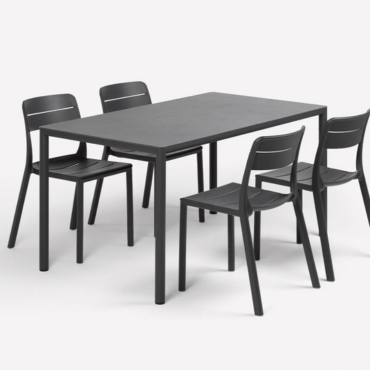 Black dining table with four matching chairs on a white background
