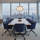 Modern conference room with large window view of a city skyline