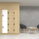 Wooden locker system with gray chairs and a small table in a room.