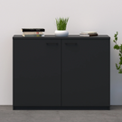Black cabinet with decorative items against a white wall