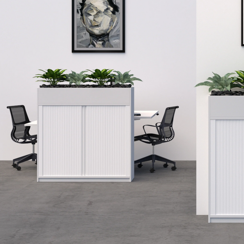 Load image into Gallery viewer, Two white office partitions with planters on top in an office setting.

