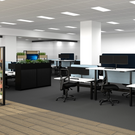 Modern office space with desks, chairs, and computer monitors.