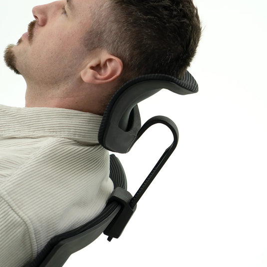 Man using a neck support device on a white background